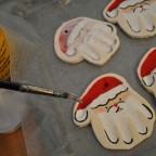 making hand print santa ornaments